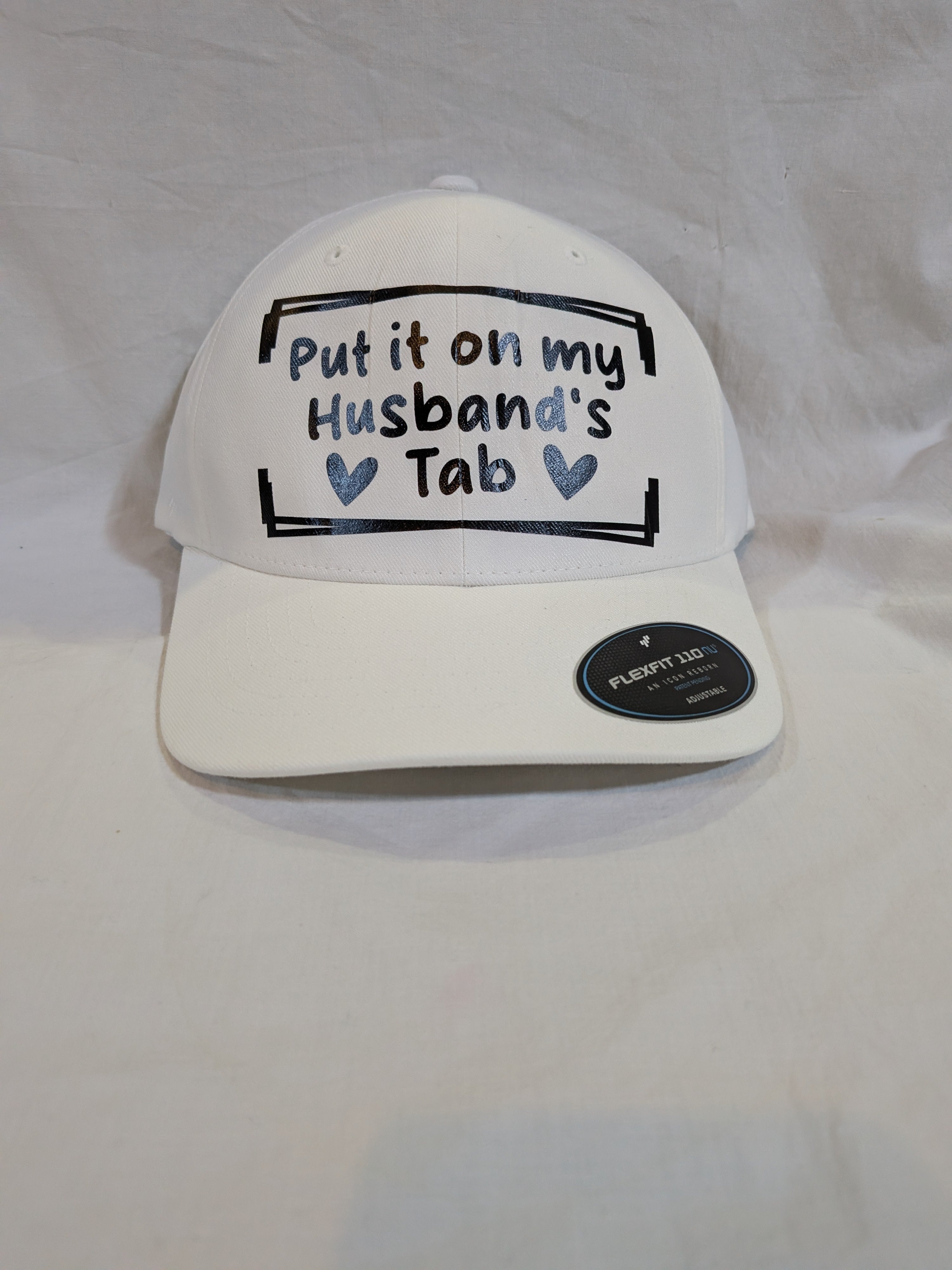 Put it on my husbands tab hat
